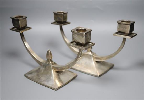 A pair of Chinese white metal two branch, two light candelabra, By Wai Kee, Hong Kong, with engraved inscription,